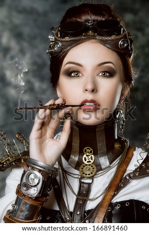 Portrait of a beautiful steampunk woman over grunge background.