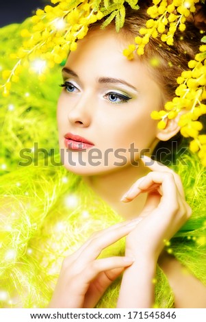 Portrait Of A Beautiful Girl With Mimosa Flowers. Spring.