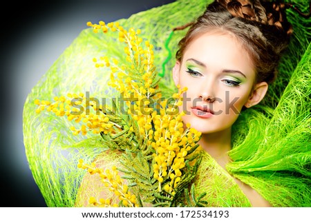 Portrait of a beautiful girl with flowers. Spring.