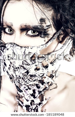Close-up portrait of a mythical creature male. Alien creature. Horror. Halloween. Isolated over white.