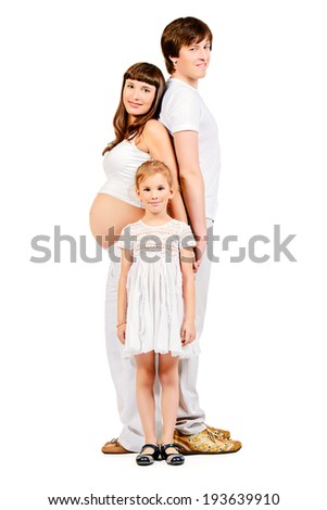 Happy family expecting one more baby. Full length portrait. Isolated over white.