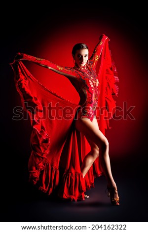 Beautiful professional dancer performs latino dance. Passion and expression.