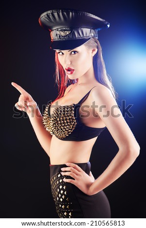 Portrait of a stunning sexual police girl posing at studio.