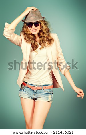 Portrait of a happy young woman with beautiful smile. Studio shot.