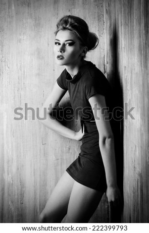 Fashion shot of a stunning female model with bright makeup. Beauty, fashion. Black-and-white photo.