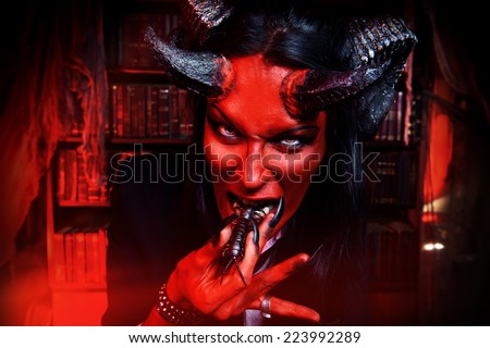 Horned Devil with insects in the mouth. Fantasy. Ancient style. Halloween.