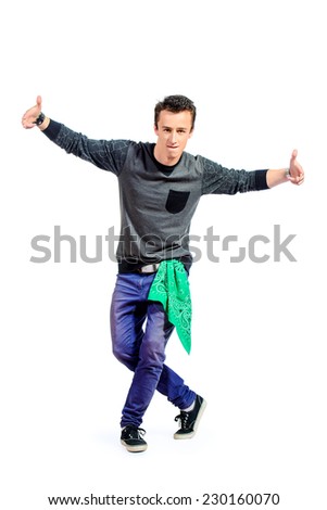 Professional young man dancer dancing hip-hop at studio. Isolated over white.