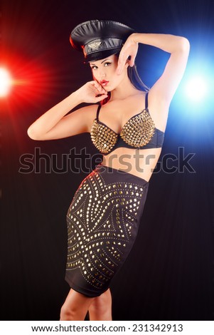 Portrait of a stunning sexual police girl posing at studio.