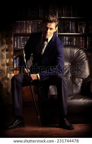 Respectable handsome man in his office. Classic vintage style.