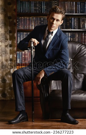 Respectable handsome man in his office. Classic vintage style.
