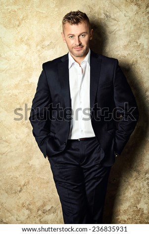 Portrait of a handsome mature man in elegant suit. Fashion, beauty.