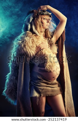 Beautiful pregnant woman warrior. Ancient times. Fantasy.