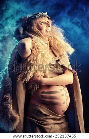 Beautiful pregnant woman warrior. Ancient times. Fantasy.
