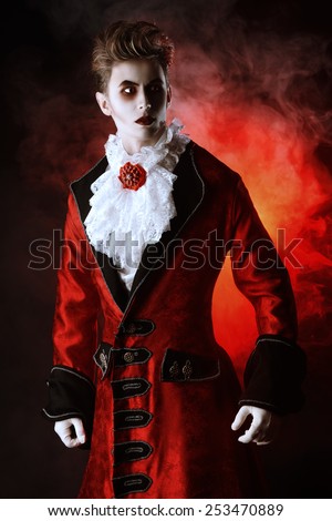 Bewitching handsome male vampire. Halloween. Dracula costume.