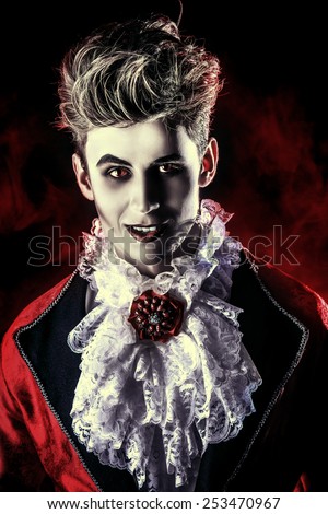 Bewitching handsome male vampire. Halloween. Dracula costume.