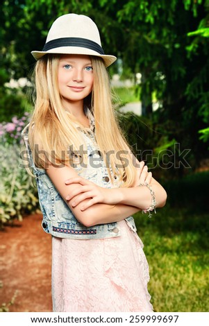 Modern girl teenager posing outdoor.