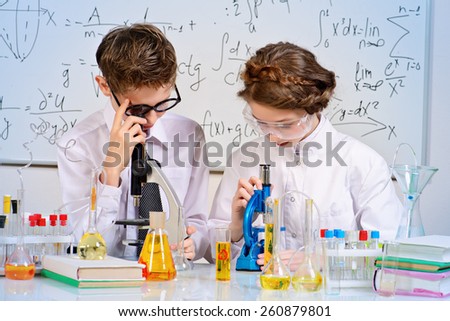 Students doing experiments in the laboratory. Science and education.