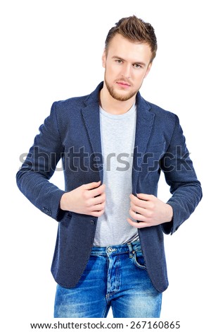 Casual young man wearing jeans and jacket posing at studio. Men\'s beauty, fashion. Isolated over white.
