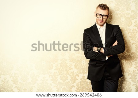 Portrait of a handsome mature man in elegant suit. Fashion, beauty. Copy space.