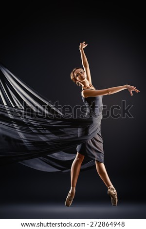 Graceful beautiful ballet dancer posing at studio. Art concept.