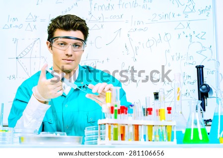 Doctor holding a syringe. Bacteriological laboratory work. Vaccinations.