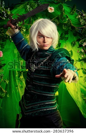 Noble blond elf with a sword in his hand in the magic forest. Fantasy. Anime style.