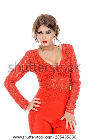 Seductive sensual woman in elegant red suit on a white background. Beauty, fashion. Isolated over white.