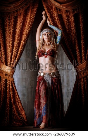 Beautiful traditional female dancer. Ethnic dance. Belly dancing. Tribal dancing.