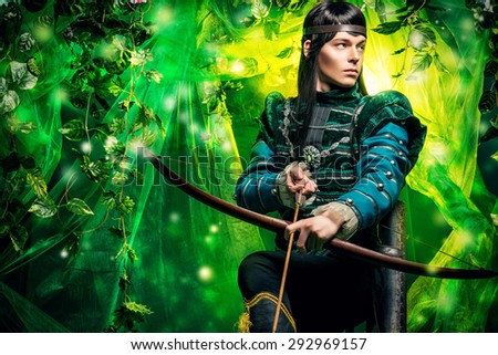 Portrait of a male elf with a bow and arrows in a magical forest.