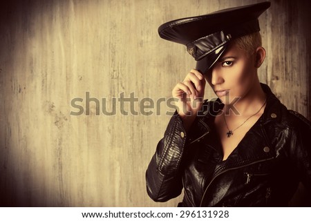 Attractive young woman alluring in a costume of police officer.