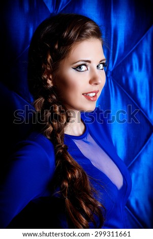 Portrait of young woman with beautiful big eyes. Make-up, cosmetics.