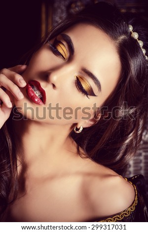 Close-up portrait of a fascinating  beautiful young woman. Vintage style. Renaissance. Fashion. Cosmetics and make-up.