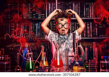 A boy doing experiments in the laboratory. Explosion in the laboratory. Science and education.