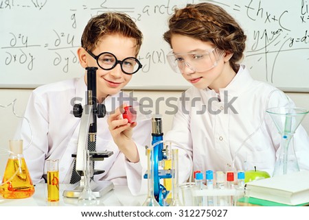 Students doing experiments in the laboratory. Science and education.