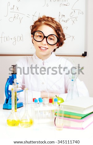 Student girl doing research in the laboratory. Science and education.