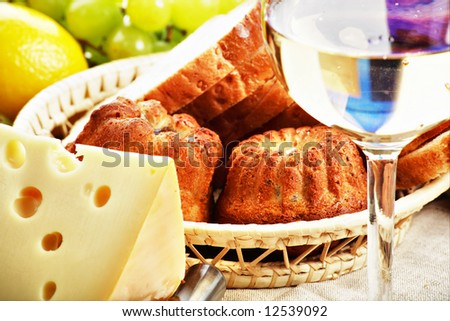 Natural form foods. Dairy produce, pastry, wine. Shot in a studio.