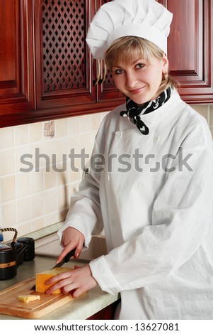 Cook woman cooking on the kitchen