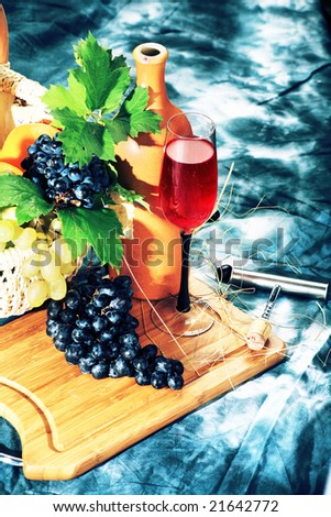 Vintage wine composition: vine and bottle of wine