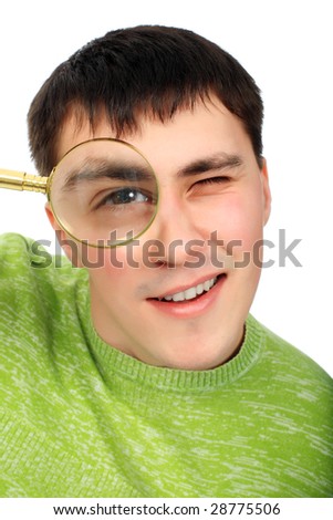 Portrat of a young man looking through the magnifying glass
