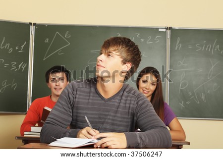 Educational theme: students in a classroom.