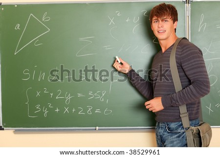 Educational theme: male student in a classroom.