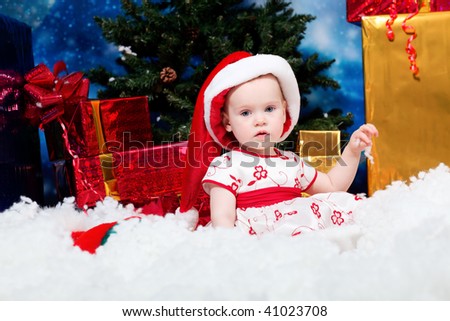 stock-photo-christmas-child-sitting-in-snowdrift-against-night-stellar-sky-41023708.jpg