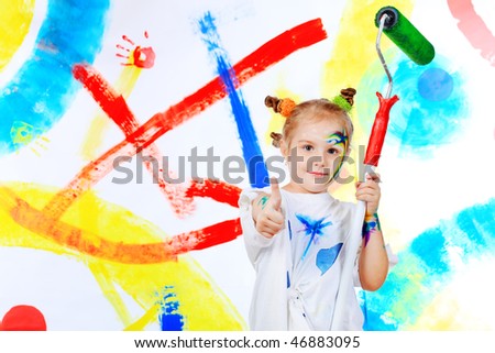 Portrait of a beautiful child enjoying her painting. Education.