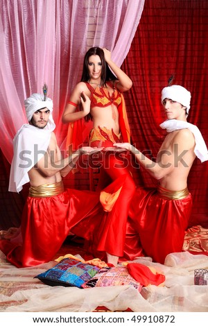 Shot of three young people in oriental costumes.