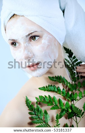 Portrait of a woman with beauty mask on her face. Spa, healthcare.