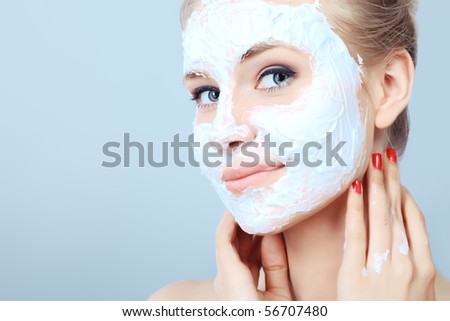 Portrait of a woman with beauty mask on her face. Spa, healthcare.
