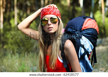 http://image.shutterstock.com/display_pic_with_logo/67164/67164,1286333908,3/stock-photo-young-woman-tourist-making-her-journey-62418577.jpg