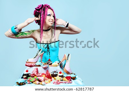 Portrait of a trendy girl with great number of sweets.