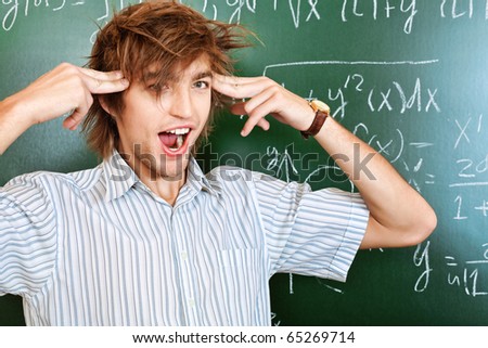 Educational theme: crazy male student in a classroom.