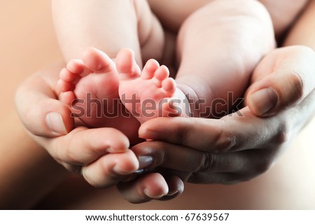 Baby's foot in mother hands Baby's foot in mother hands